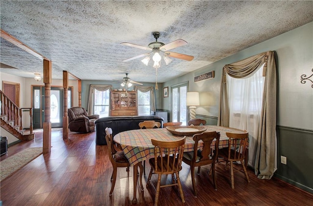 90 Wiley Dr, Douglasville, GA 30134 - dining room with a textured ceiling, stairway, wood finished floors, and a ceiling fan