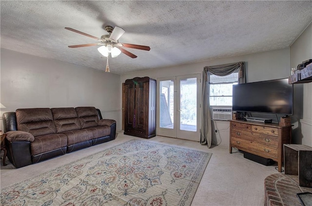 90 Wiley Dr, Douglasville, GA 30134 - living room with carpet flooring, a ceiling fan, a textured ceiling, cooling unit, and french doors