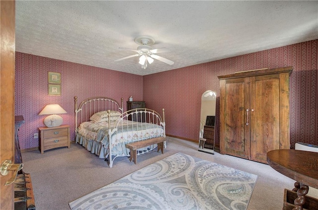90 Wiley Dr, Douglasville, GA 30134 - bedroom with wallpapered walls, light colored carpet, a textured ceiling, and ceiling fan