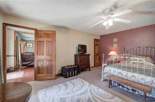 90 Wiley Dr, Douglasville, GA 30134 - bedroom with baseboards, a textured ceiling, wallpapered walls, carpet floors, and ceiling fan