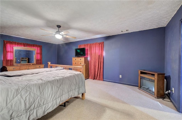 90 Wiley Dr, Douglasville, GA 30134 - carpeted bedroom featuring a textured ceiling, ceiling fan, and baseboards