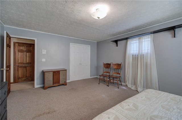 90 Wiley Dr, Douglasville, GA 30134 - carpeted bedroom featuring a textured ceiling, crown molding, a closet, and baseboards
