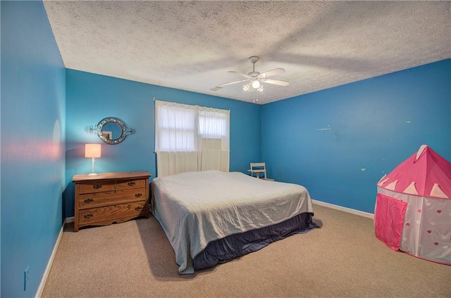 90 Wiley Dr, Douglasville, GA 30134 - bedroom with baseboards, carpet floors, a ceiling fan, and a textured ceiling