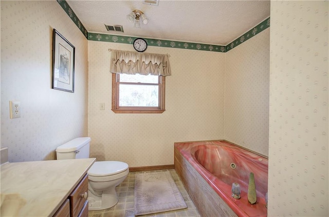 90 Wiley Dr, Douglasville, GA 30134 - full bathroom featuring toilet, a whirlpool tub, vanity, a textured ceiling, and wallpapered walls