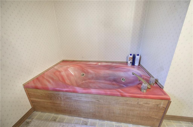 90 Wiley Dr, Douglasville, GA 30134 - full bath with wallpapered walls, a tub with jets, and baseboards