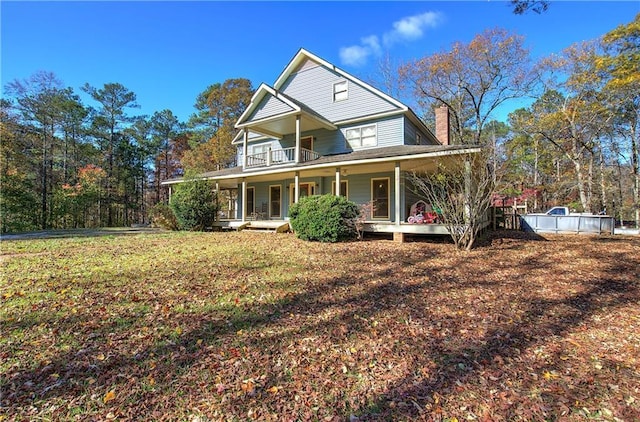 90 Wiley Dr, Douglasville, GA 30134 - country-style home featuring covered porch, a chimney, and a balcony