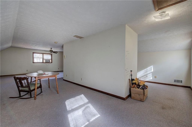 90 Wiley Dr, Douglasville, GA 30134 - unfurnished dining area with a textured ceiling, vaulted ceiling, carpet floors, baseboards, and a ceiling fan