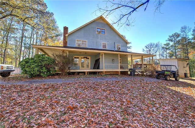 90 Wiley Dr, Douglasville, GA 30134 - rear view of property featuring a porch and a chimney