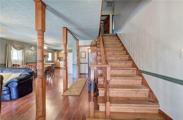 90 Wiley Dr, Douglasville, GA 30134 - stairs with wood finished floors and a textured ceiling