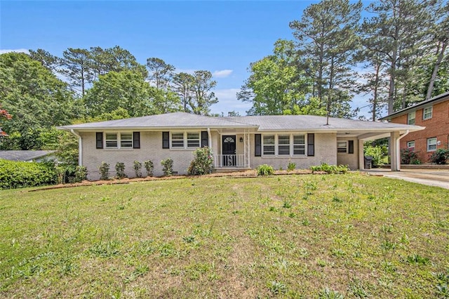 3436 Dodson Ter, Atlanta, GA 30344 - ranch-style house with driveway, a front lawn, an attached carport, and brick siding