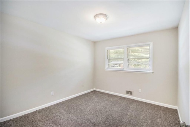 3436 Dodson Ter, Atlanta, GA 30344 - spare room with dark colored carpet and baseboards