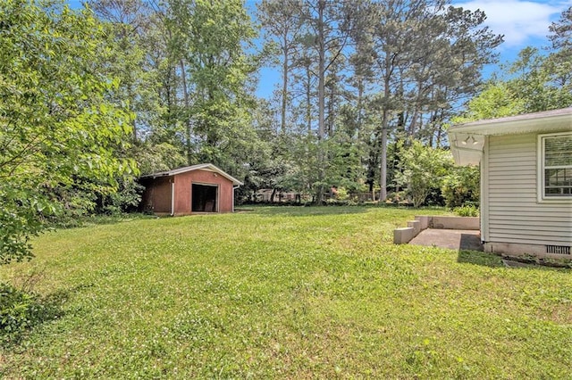 3436 Dodson Ter, Atlanta, GA 30344 - view of grassy yard featuring an outbuilding