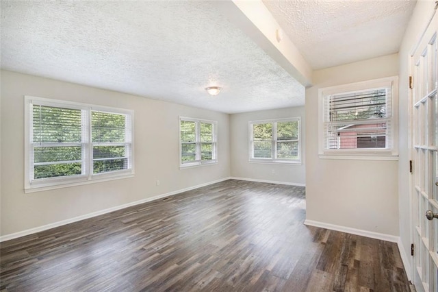 3436 Dodson Ter, Atlanta, GA 30344 - empty room featuring a textured ceiling, dark wood-style flooring, and baseboards