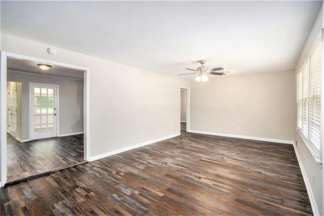 3436 Dodson Ter, Atlanta, GA 30344 - unfurnished room with dark wood-style flooring, a ceiling fan, and baseboards