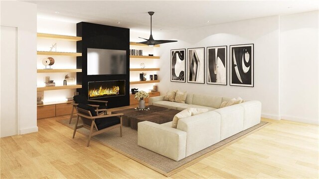 living room with a fireplace, ceiling fan, and light wood-type flooring