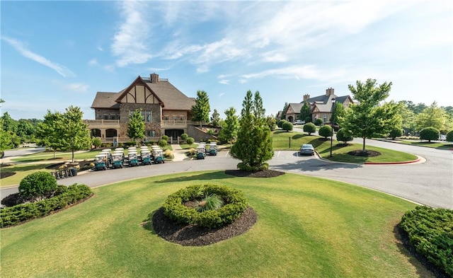 view of home's community featuring a lawn