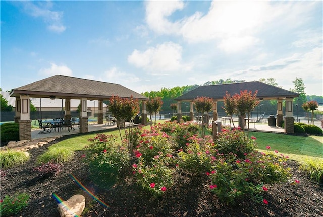 surrounding community with a patio and a gazebo