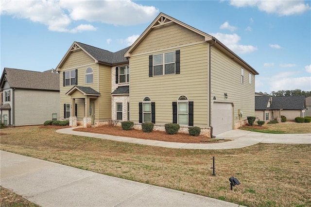 craftsman-style home with a garage and a front yard