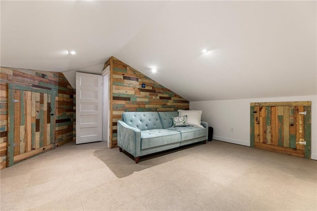 527 Main St, Suwanee, GA 30024 - living area with vaulted ceiling, wood walls, and carpet