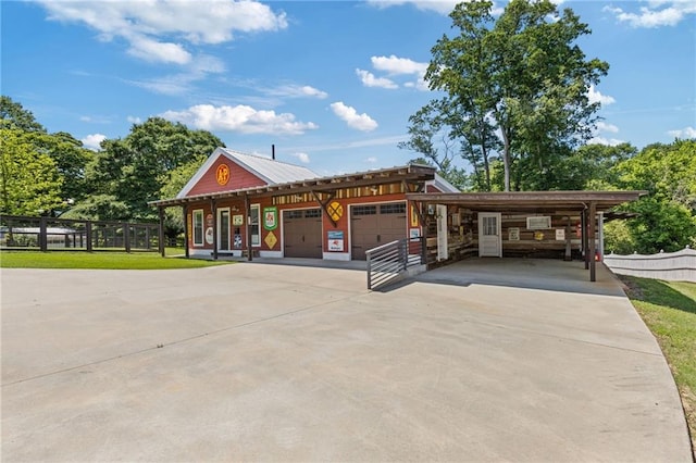 527 Main St, Suwanee, GA 30024 - view of front of property with a garage, concrete driveway, and a carport