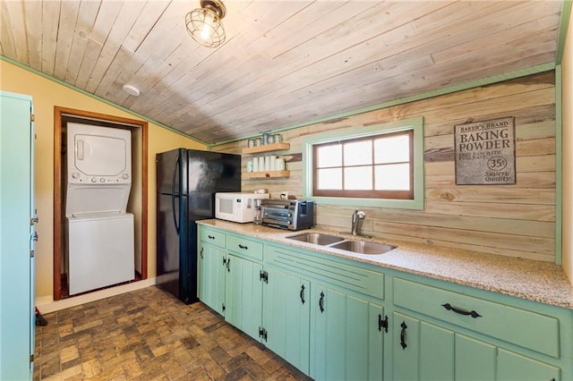 527 Main St, Suwanee, GA 30024 - kitchen featuring stacked washer and clothes dryer, white microwave, lofted ceiling, wood ceiling, and freestanding refrigerator
