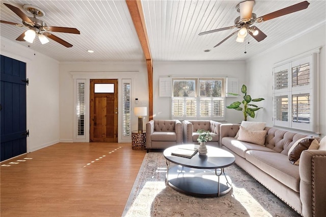 living room with light hardwood / wood-style flooring, wooden ceiling, and a wealth of natural light