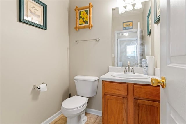 bathroom featuring vanity, toilet, and tile patterned flooring