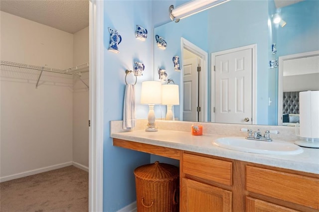 bathroom featuring vanity and a textured ceiling