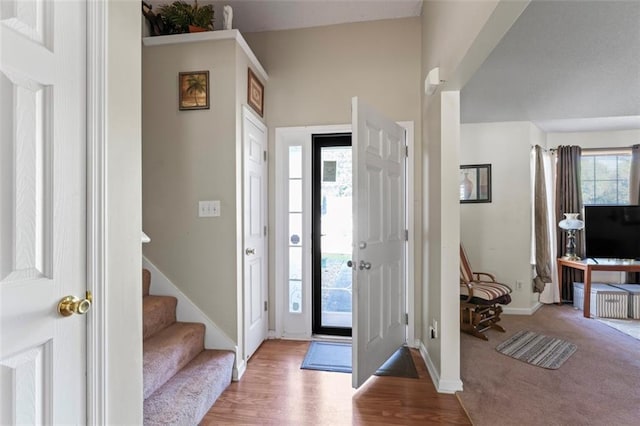 foyer entrance with light hardwood / wood-style floors