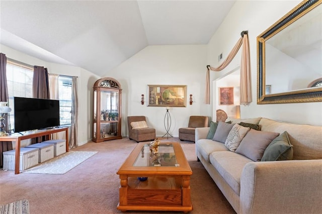 carpeted living room with vaulted ceiling