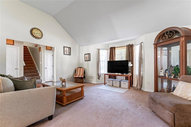 living room featuring light carpet and high vaulted ceiling