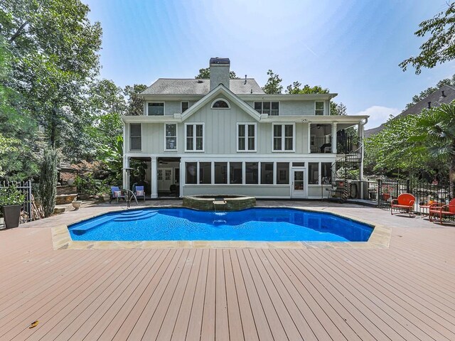 view of front of house featuring a porch, a front yard, and a garage