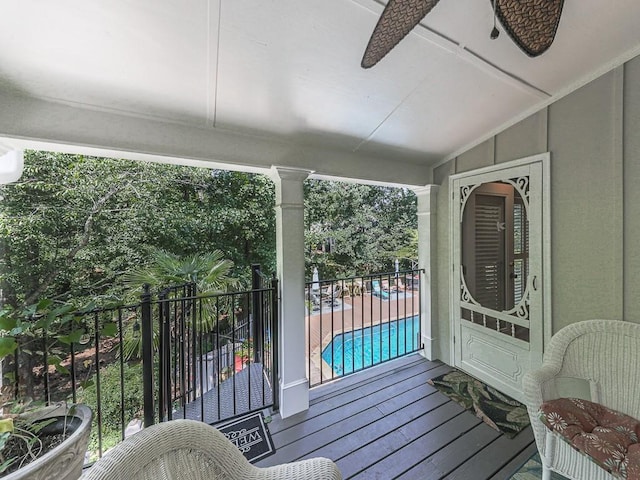 sunroom featuring ceiling fan and vaulted ceiling