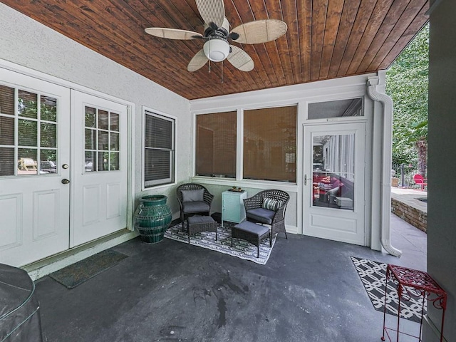 view of patio / terrace featuring a ceiling fan and french doors