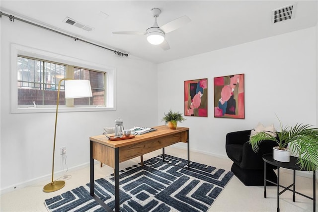 office with visible vents, baseboards, and a ceiling fan