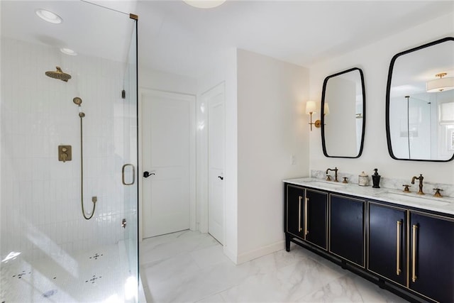 full bath featuring marble finish floor, double vanity, a stall shower, and a sink