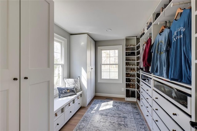 walk in closet featuring light wood-style floors