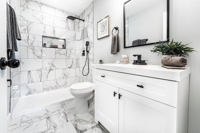 661 Inglewood Dr SE, Smyrna, GA 30080 - full bath featuring marble look tiles, vanity, toilet, and tiled shower