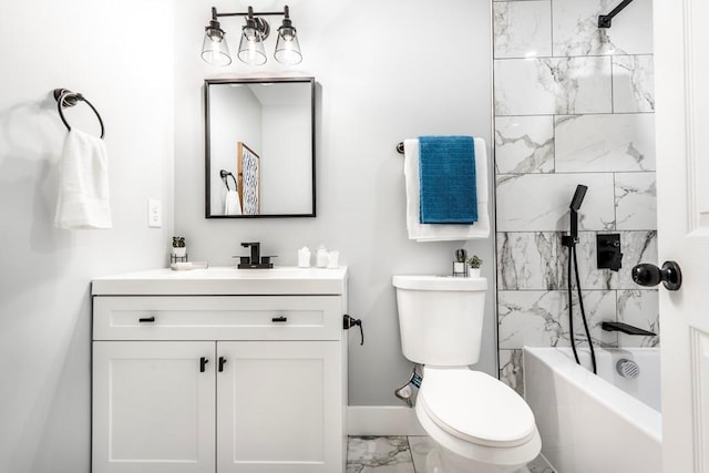 661 Inglewood Dr SE, Smyrna, GA 30080 - bathroom with marble finish flooring, vanity, toilet, baseboards, and tub / shower combination