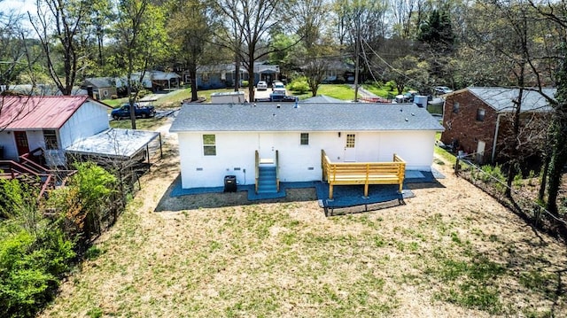 661 Inglewood Dr SE, Smyrna, GA 30080 - back of house with view of wooded area and a deck