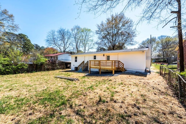 661 Inglewood Dr SE, Smyrna, GA 30080 - back of property featuring a wooden deck and a chimney