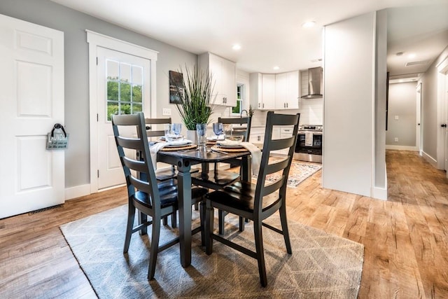 661 Inglewood Dr SE, Smyrna, GA 30080 - dining area with baseboards, light wood finished floors, and recessed lighting