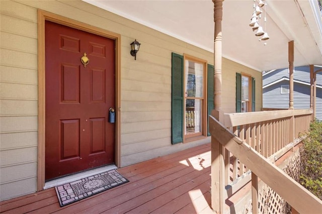 view of exterior entry featuring a porch