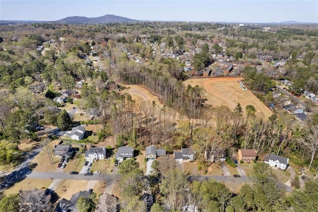 aerial view of property and surrounding area with a mountainous background