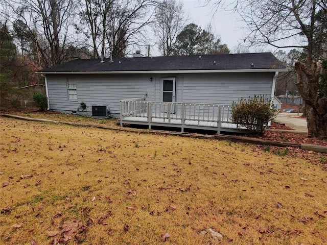 back of property with central air condition unit and a wooden deck