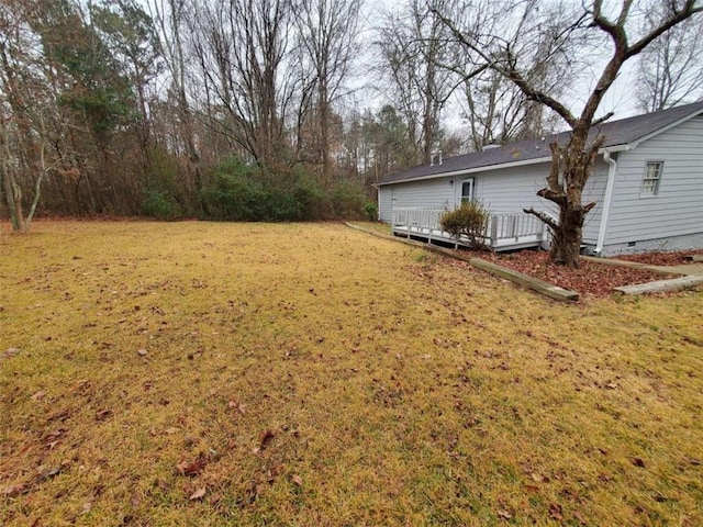 view of yard with a wooden deck