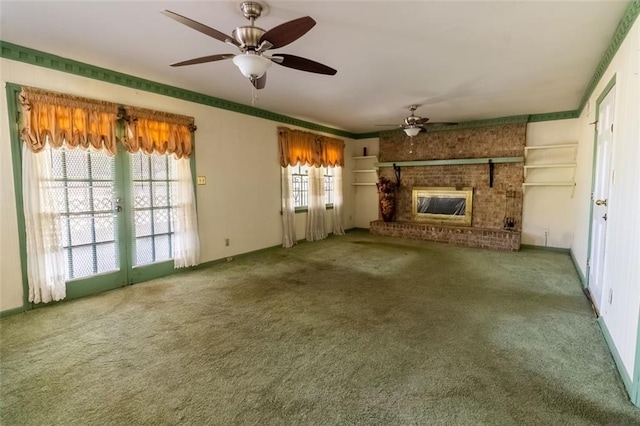 unfurnished living room with ornamental molding, carpet floors, ceiling fan, and baseboards