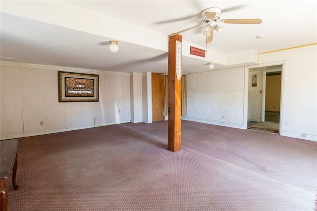 finished basement featuring a ceiling fan and carpet flooring
