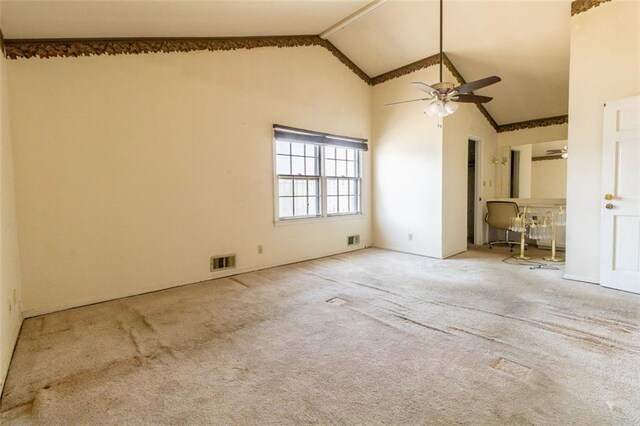 unfurnished bedroom with high vaulted ceiling, visible vents, and carpet floors