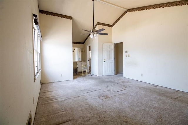 unfurnished bedroom featuring high vaulted ceiling, ceiling fan, and carpet flooring